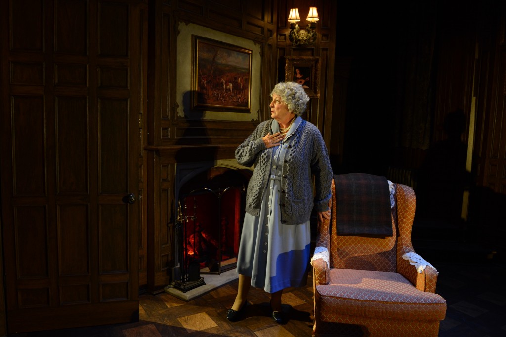 Miss Casewell (Gail Rastorfer), left, looks on as guesthouse owner Mollie Ralston (Katherine Amadeo) receives an alarming phone call in Agatha Christie: The Mousetrap, live at the Maltz Jupiter Theatre through November 8. Photo by Alicia Donelan.